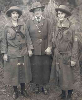   scenes of early Girl Scouts/Girl Guides on lid and around the sides