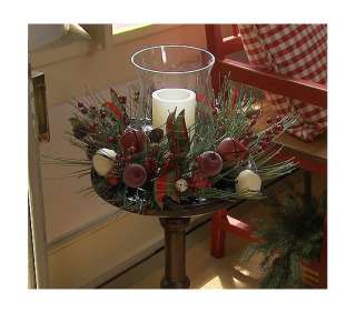 Includes wreath, glass hurricane, and battery operated pillar candle