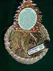 Handwoven pine needle basket with potpourri and scent