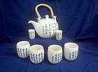 Chinese Tea pot with cups and tasting cups